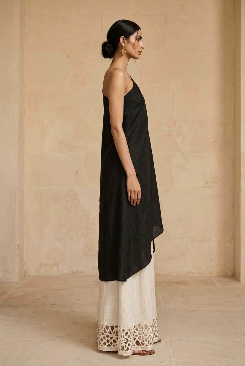 One-Shoulder Draped Tunic and Fluid Linen Palazzos Co-ord in Washed Charcoal Black & Bone Ecru, worn